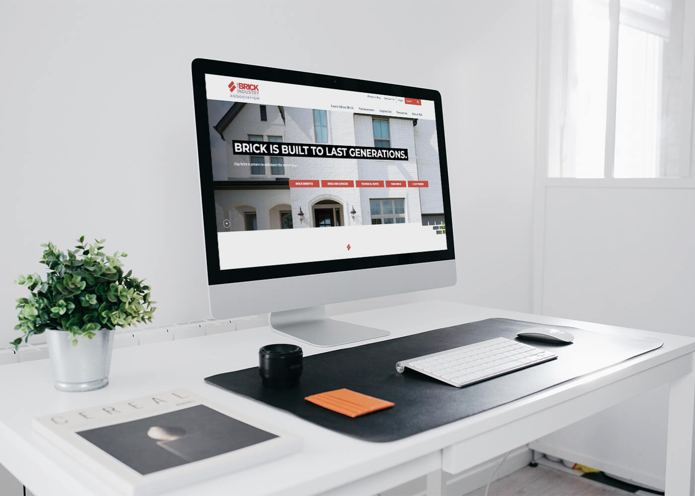 Desktop monitor displaying the Brick Industry Association website