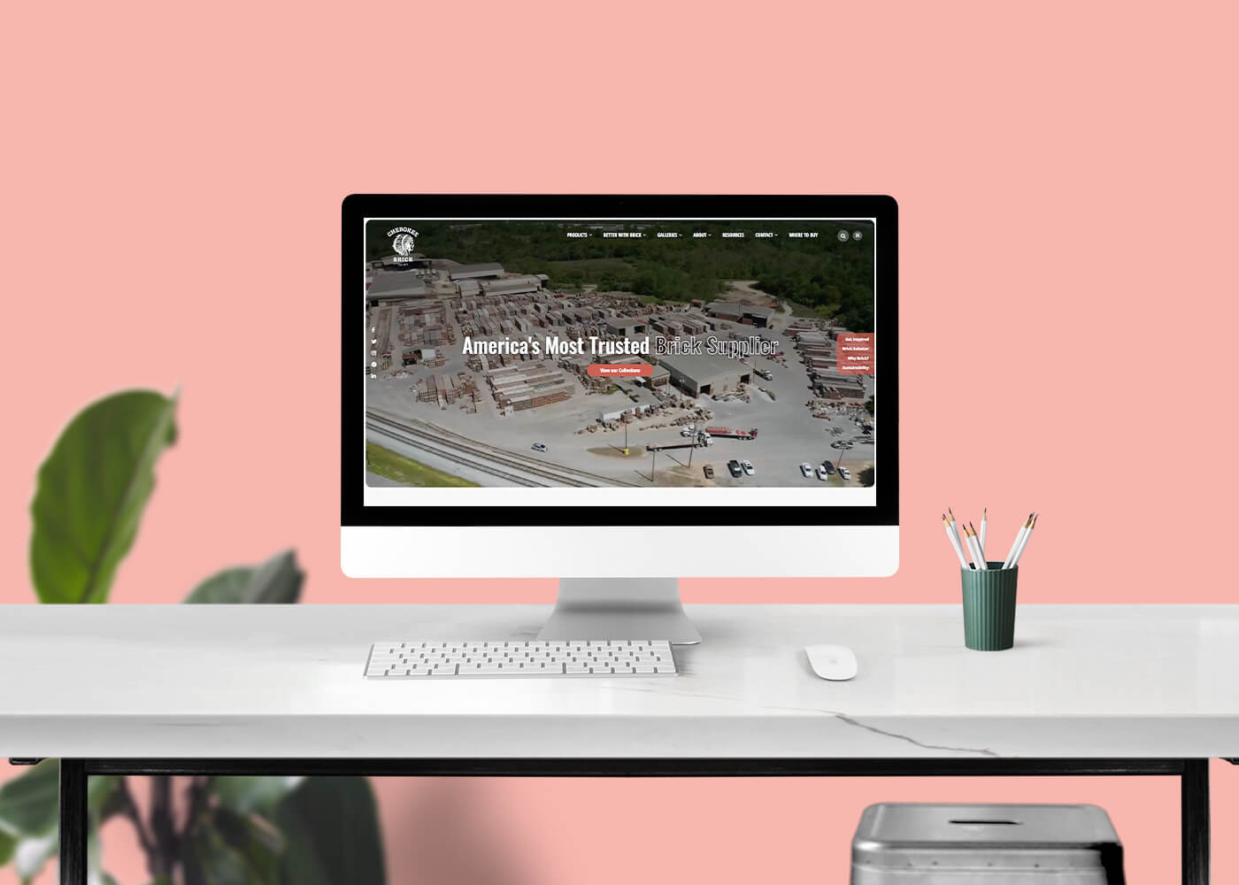 Desktop monitor on top of a desk showcasing the Cherokee Brick site's homepage