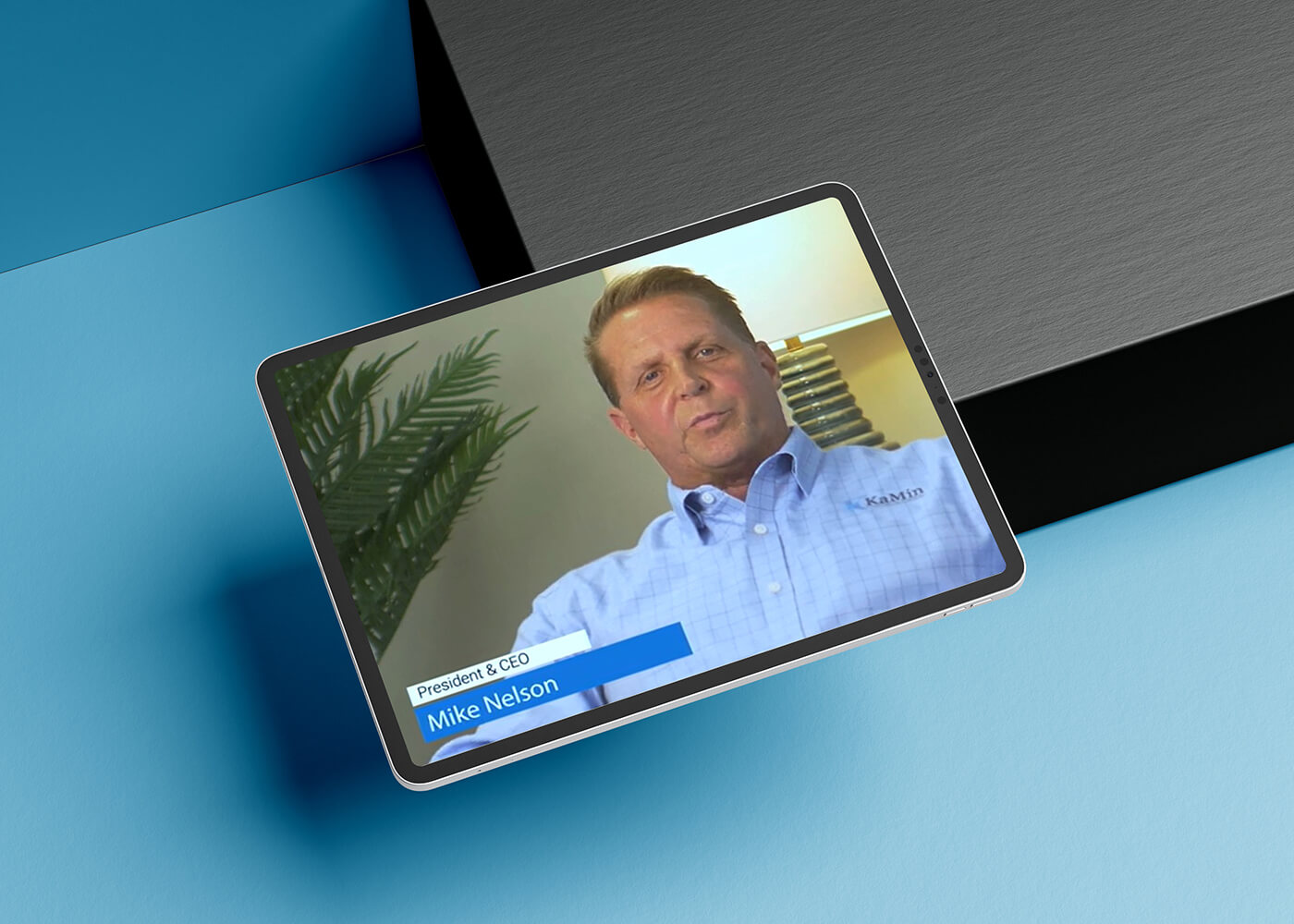 Tablet displaying an interview with KaMin president and CEO, Mike Nelson