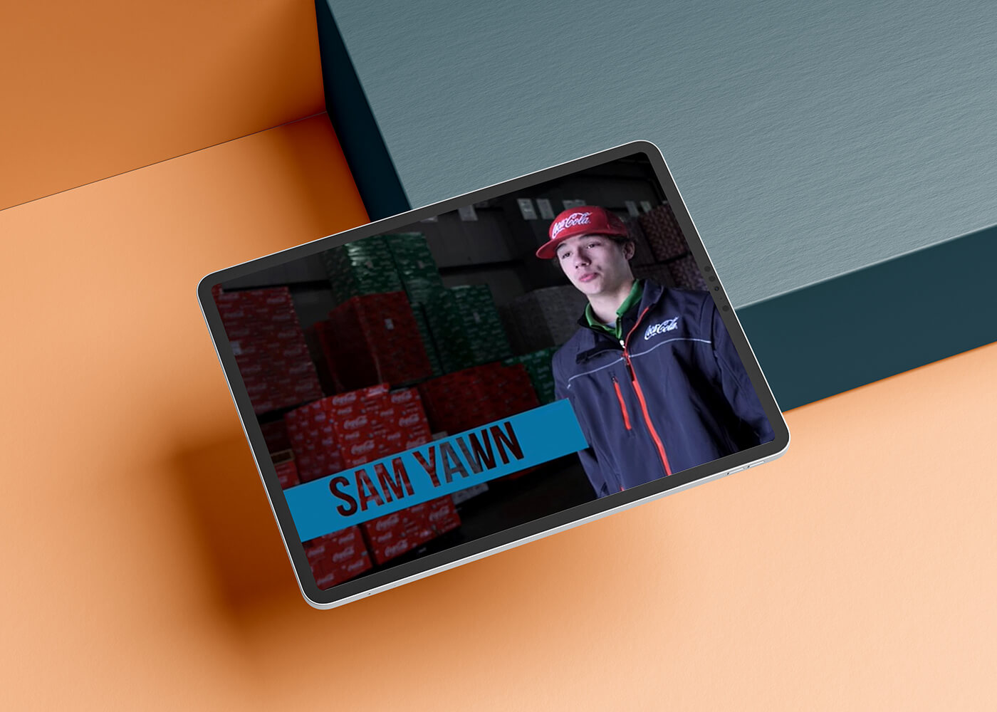 Tablet displaying an image of an interview with Sam Yawn