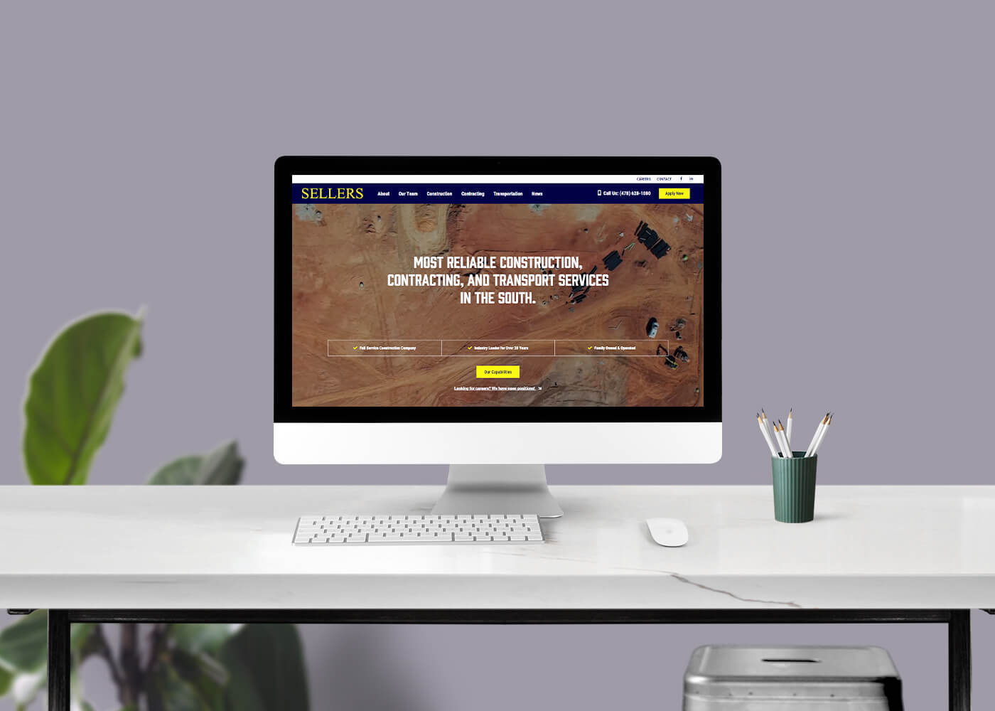 Desktop monitor displaying the Sellers Construction site homepage
